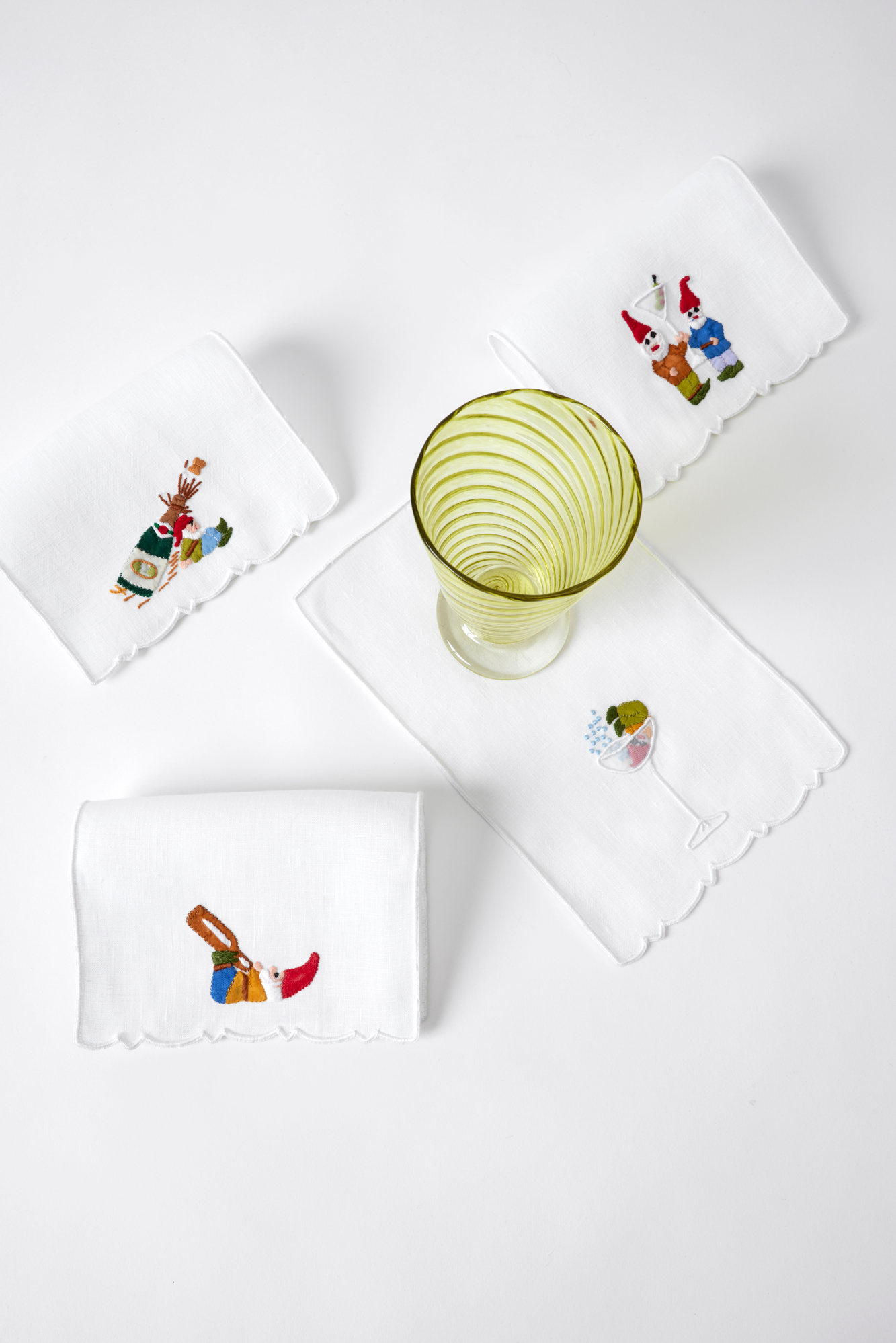 Set of four Gnome linen cocktail napkins made with hand embroidery and appliqué in Madeira, Portugal.