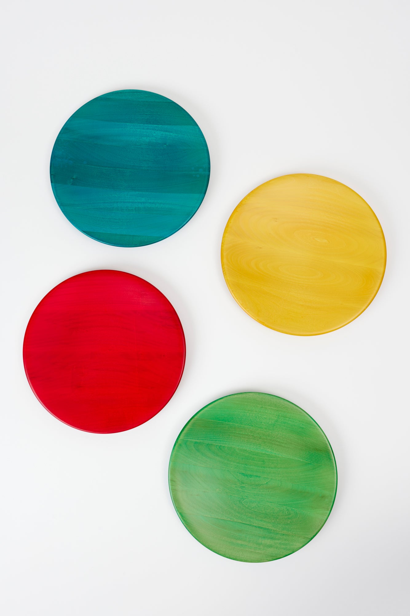 Wooden service plates designed by Manzoni Pietro and made from linden and alder hardwood in Bergamo, Italy.