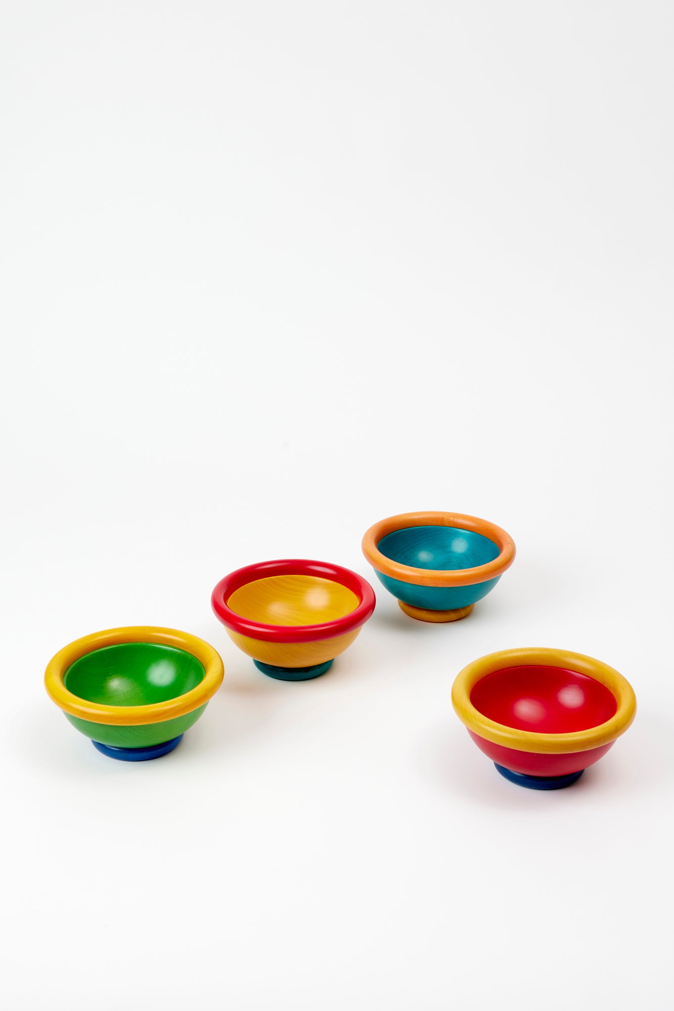Colorful whimsical wooden bowls, designed by Manzoni Pietro.