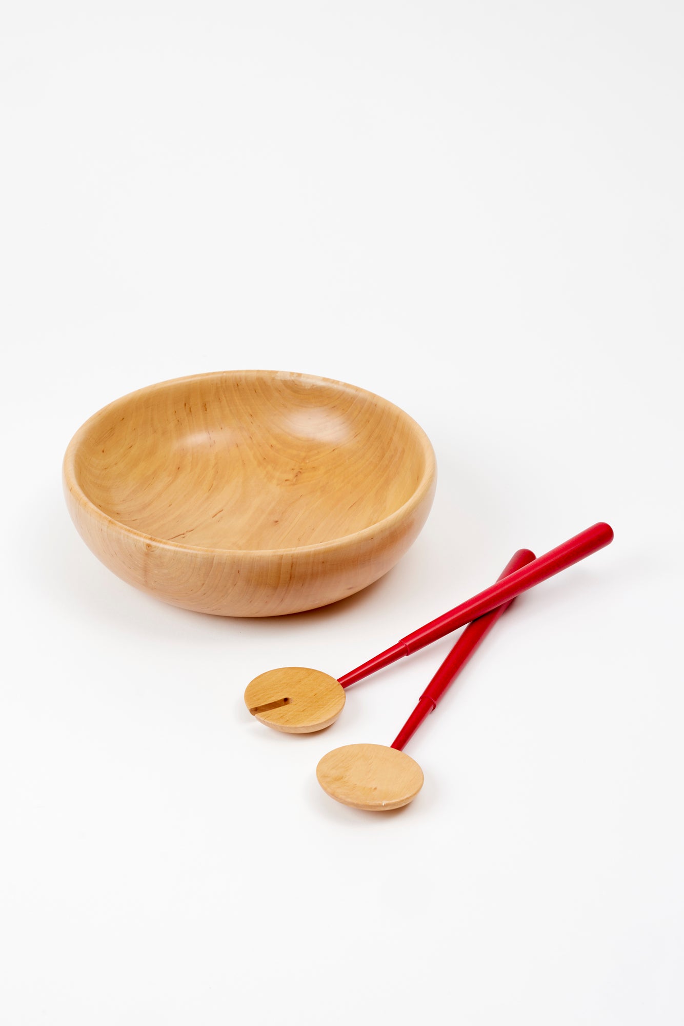 Beautifully turned wood serving bowl is perfect for tossing salad.