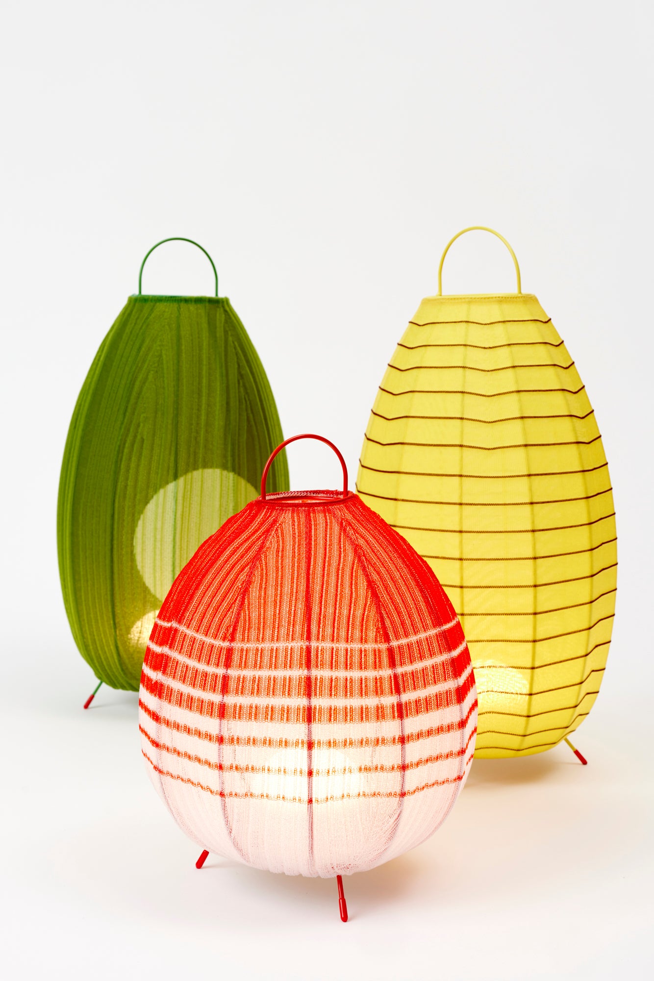 Portable table lanterns made from nylon knitted onto a lacquered steel base to emulate the textures of native Mexican flora. Designed and made in Madrid.
