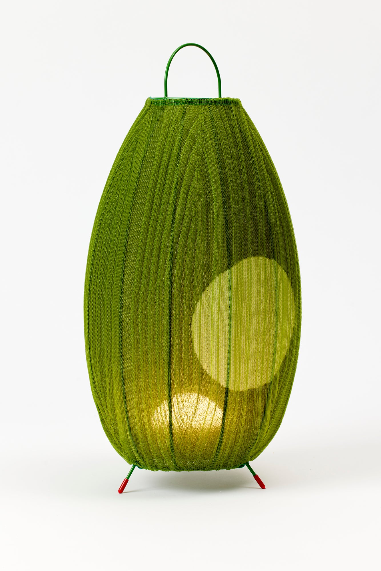 Portable table lanterns made from nylon knitted onto a lacquered steel base to emulate the textures of native Mexican flora. Designed and made in Madrid.