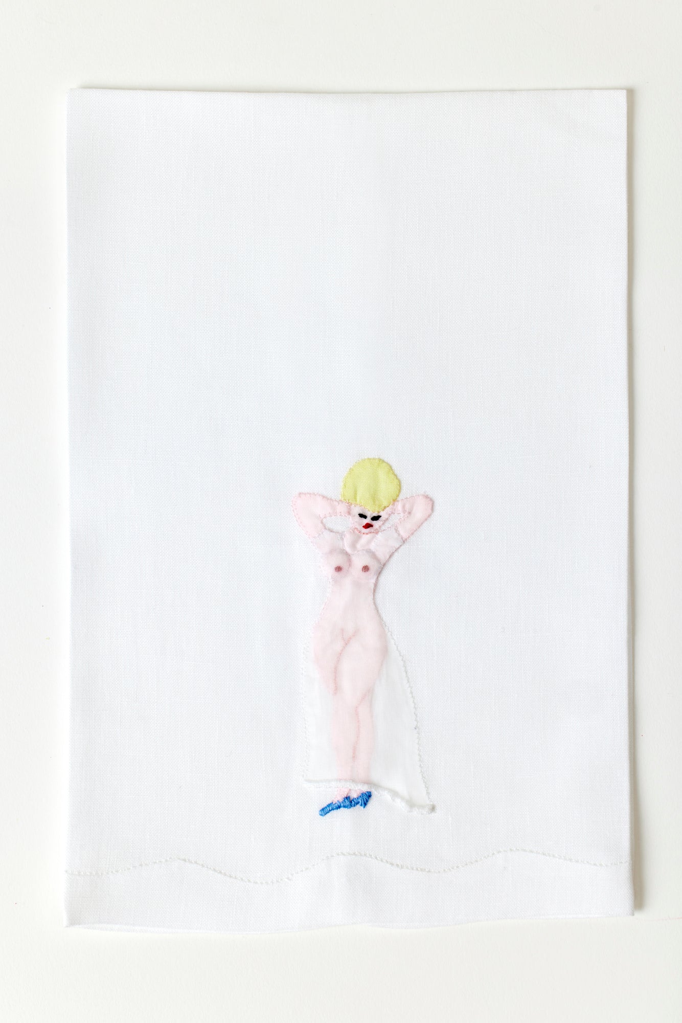 Naked woman guest towel made with hand embroidery and appliqué in Madeira, Portugal.