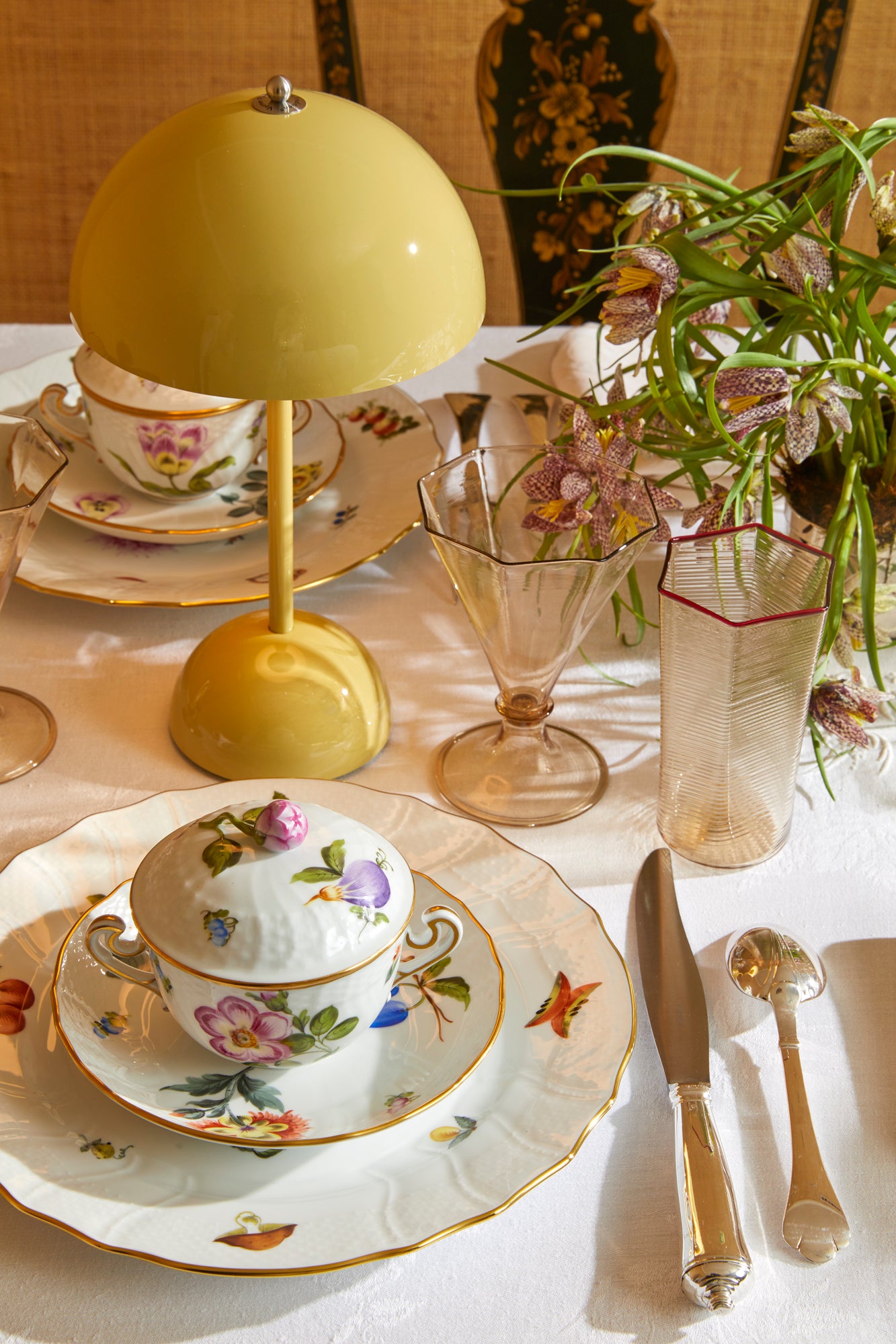 Porcelain dinnerware that has playful pattern surprises with tiny pink radishes, mushrooms and acorns.