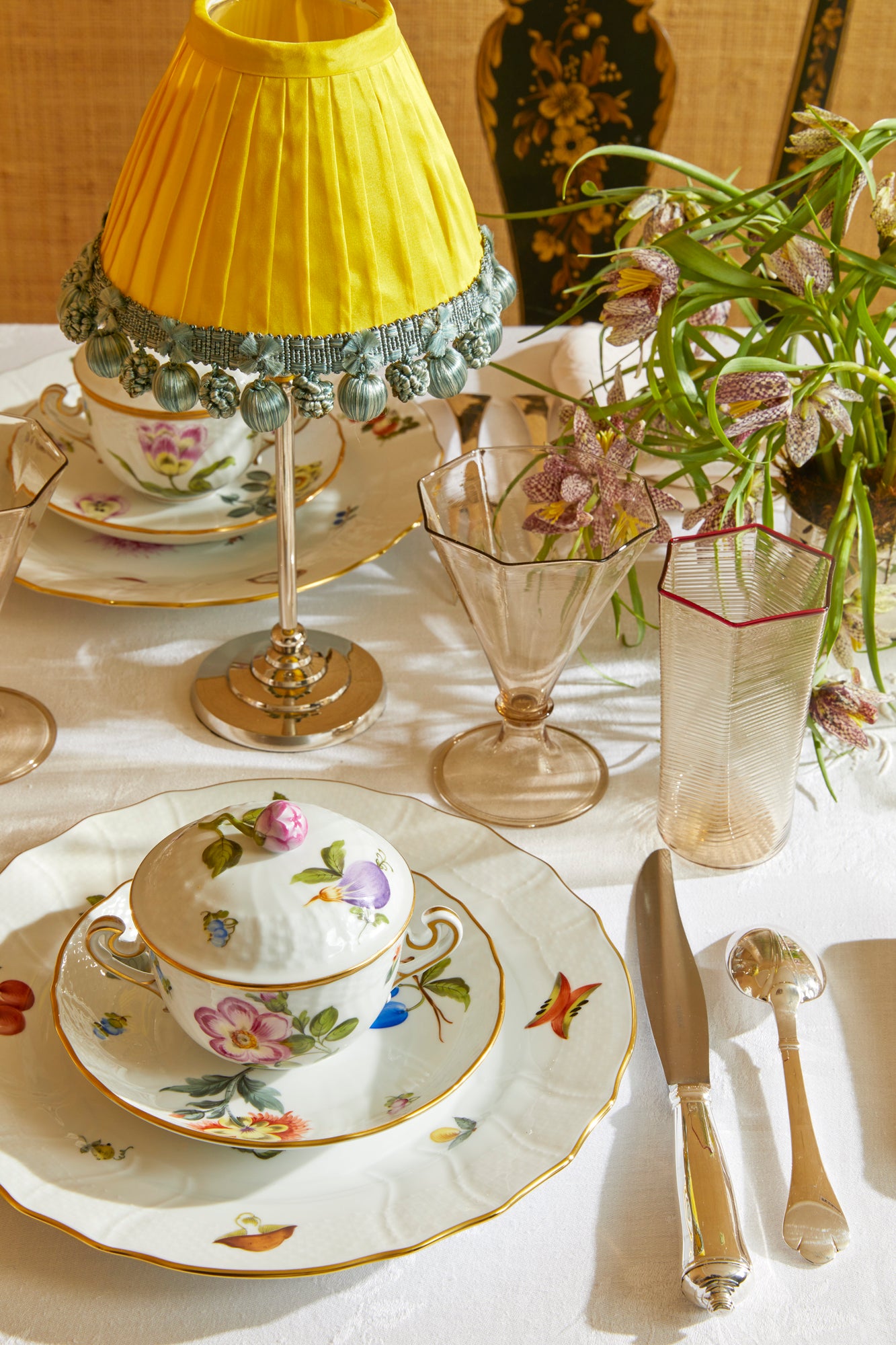 Market Garden designs on porcelain. Five piece place setting includes dinner plate, dessert plate, bread & butter plate and tea cup with saucer. 