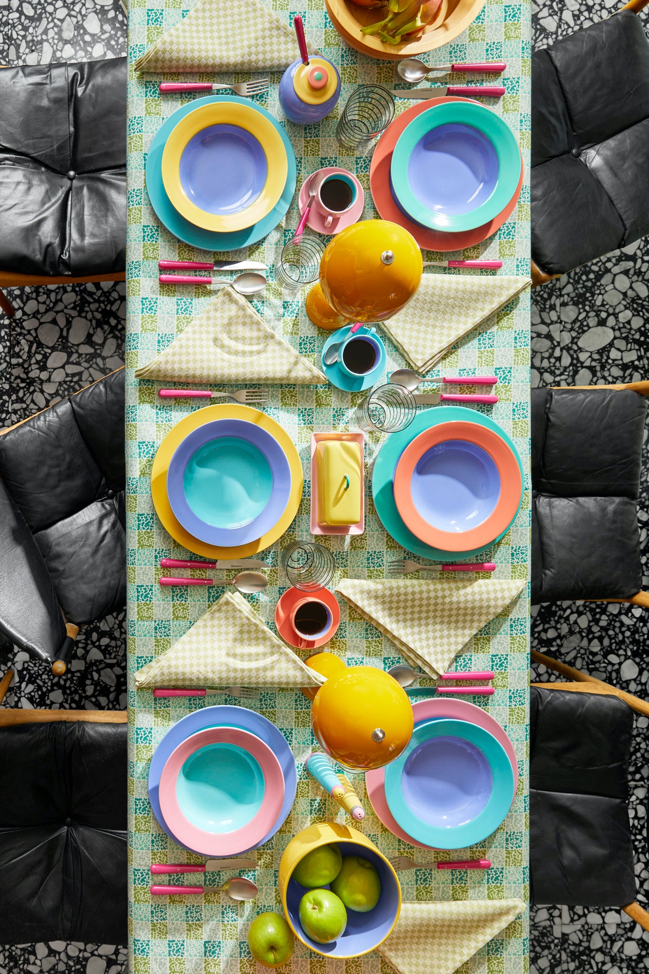 Tablecloth in “Dash Endive" linen by Lee Jofa. Designed by Kelly Wearstler, this post-modernized take on a traditional block print checkers lime and tourmalines for endless dinnerware pairings.