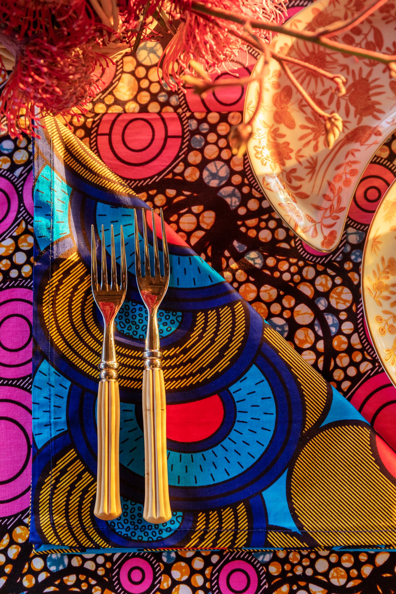 Blue, green and red table linens were made by Ankara Company located in Johannesburg, South Africa.