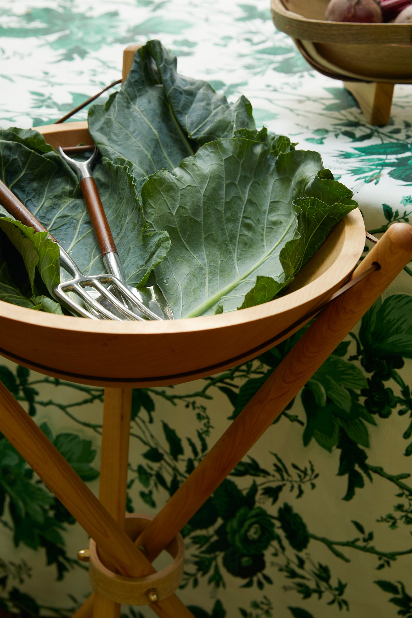 Salad utensils inspired by garden tools.